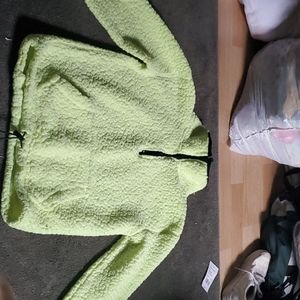 A neon yellow cropped shirt